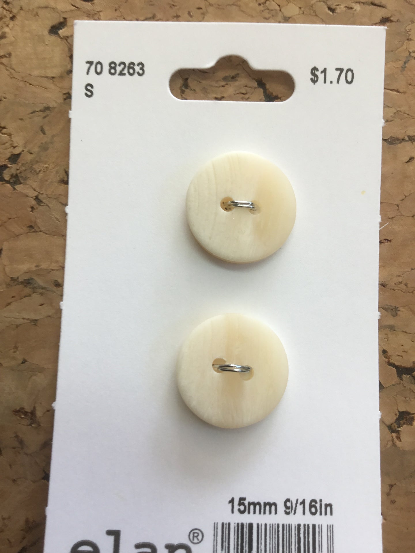 Warm white plastic horn buttons
